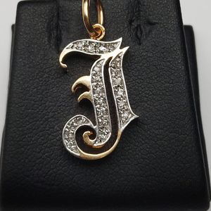  14kt yellow gold "J" pendant w/ cz stones 