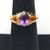 18kt yellow gold ring w/ purple stone 